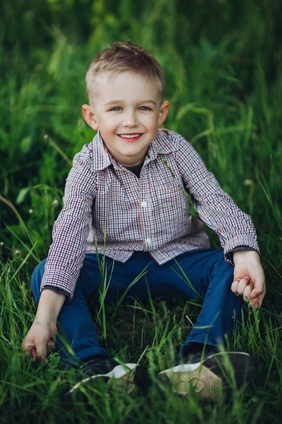 portrait-stylish-blonde-little-boy-wearing-checkered-shirt-jeans-sitting-park-summertime-among-grass-handsome-boy-playing-smiling-camera-kids-look-fashion_132075-12505.jpg