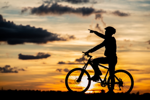 cyclist-resting-silhouette-sunset-active-outdoor-sport-concept_1150-16693.jpg