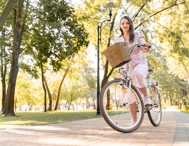 elegant-young-woman-riding-bicycle_23-2148733540.jpg