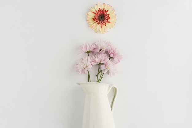 white-vase-with-flowers-purple-tones_23-2147601271.jpg