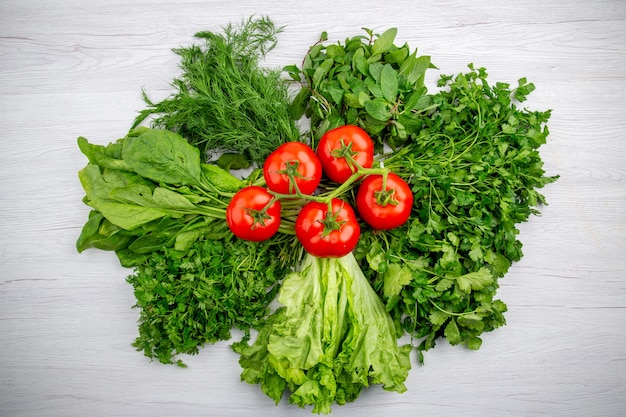 top-view-bundles-fresh-greens-tomatoes-with-stem-white-background_140725-143206.jpg