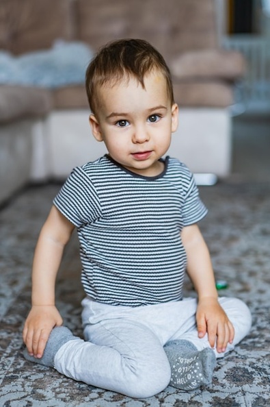 young-boy-sitting-floor-cozy-room-little-boy-sitting-floor-room_116317-29524.jpg
