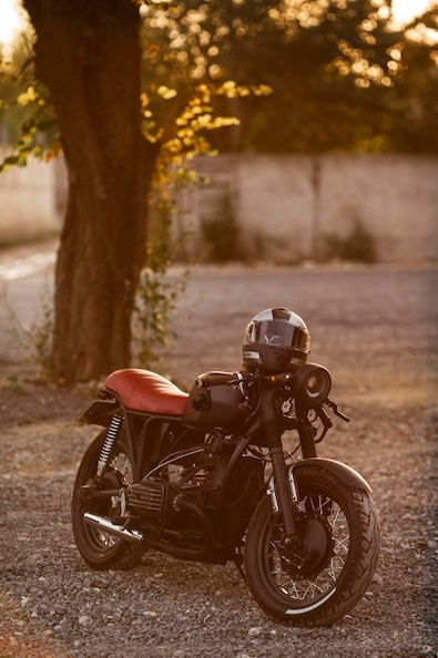 old-motorcycle-with-helmet-outdoors_23-2148703219.jpg