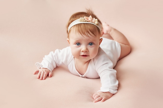 girl-four-months-lies-light-pink-background_108930-6.jpg