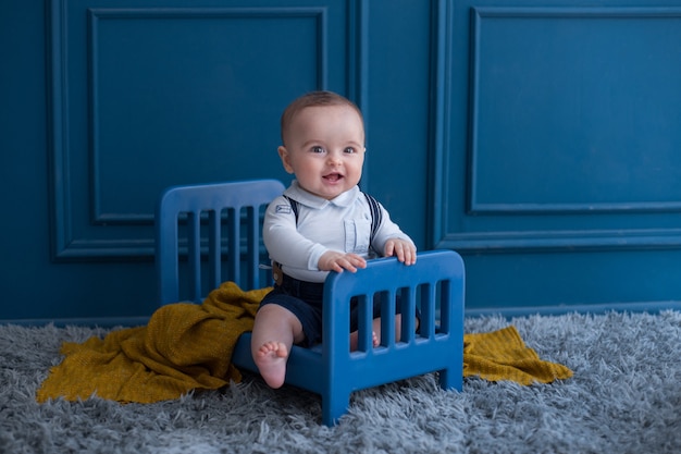 toddler-with-elegant-outfist-inside-decorative-bed-room_114579-2890.jpg