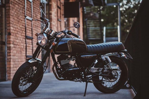 brand-new-shiny-black-retro-chopper-is-parked-brick-building_613910-3242.jpg