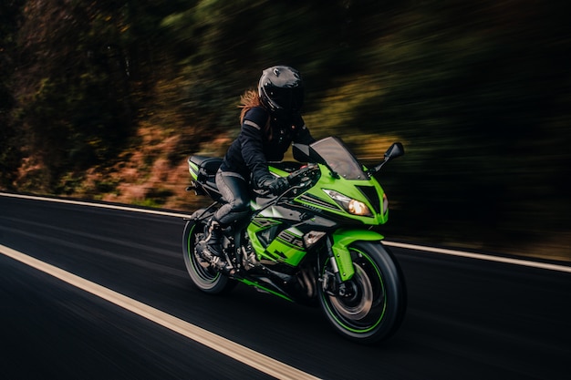driving-green-motorcycle-road_114579-5048.jpg