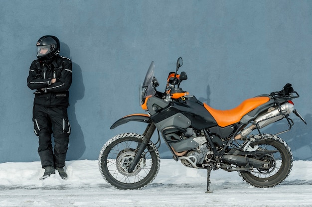man-standing-beside-motorcycle-with-helmet_23-2148875787.jpg