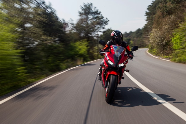 red-motorcycle-driving-road_114579-5068.jpg